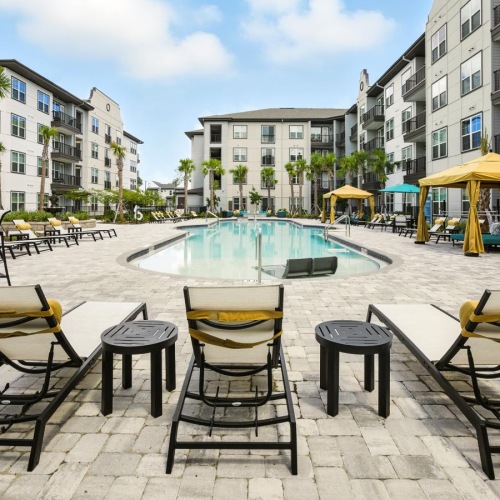 a pool with chairs around it