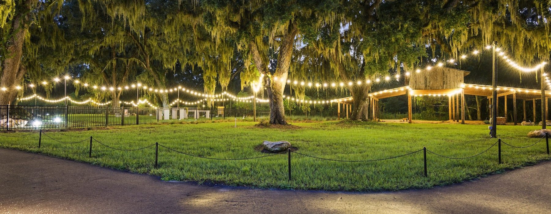 a park with a fence and trees