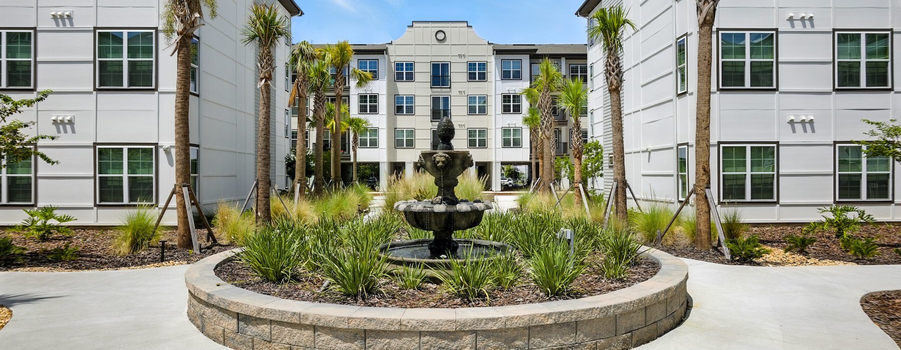 a fountain in a courtyard with buildings