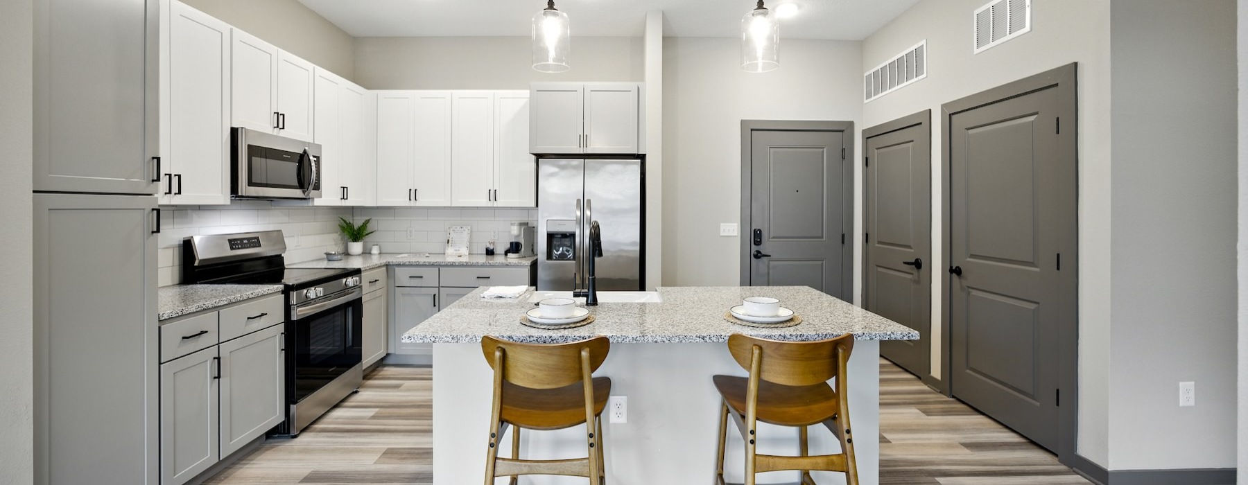 a kitchen with white cabinets