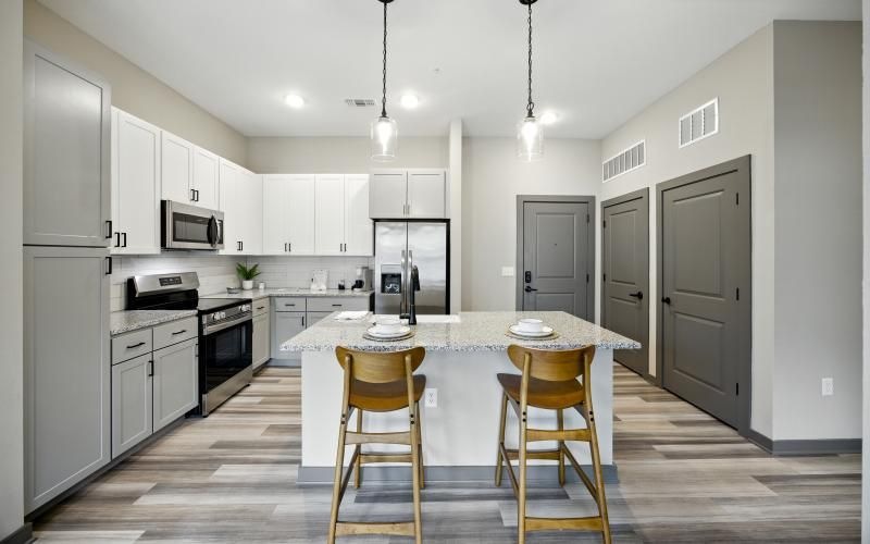 a kitchen with white cabinets